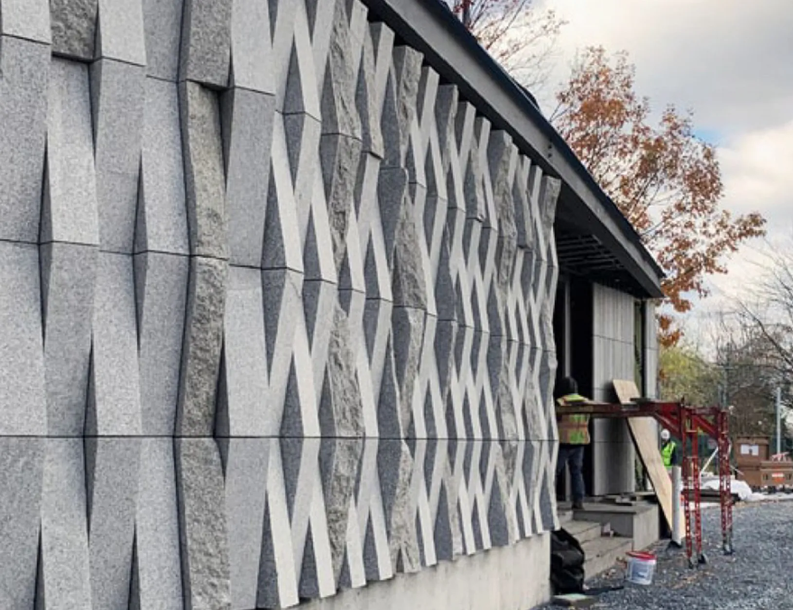 Installation pulley system with volunteers to elevate plastic cup ribbons