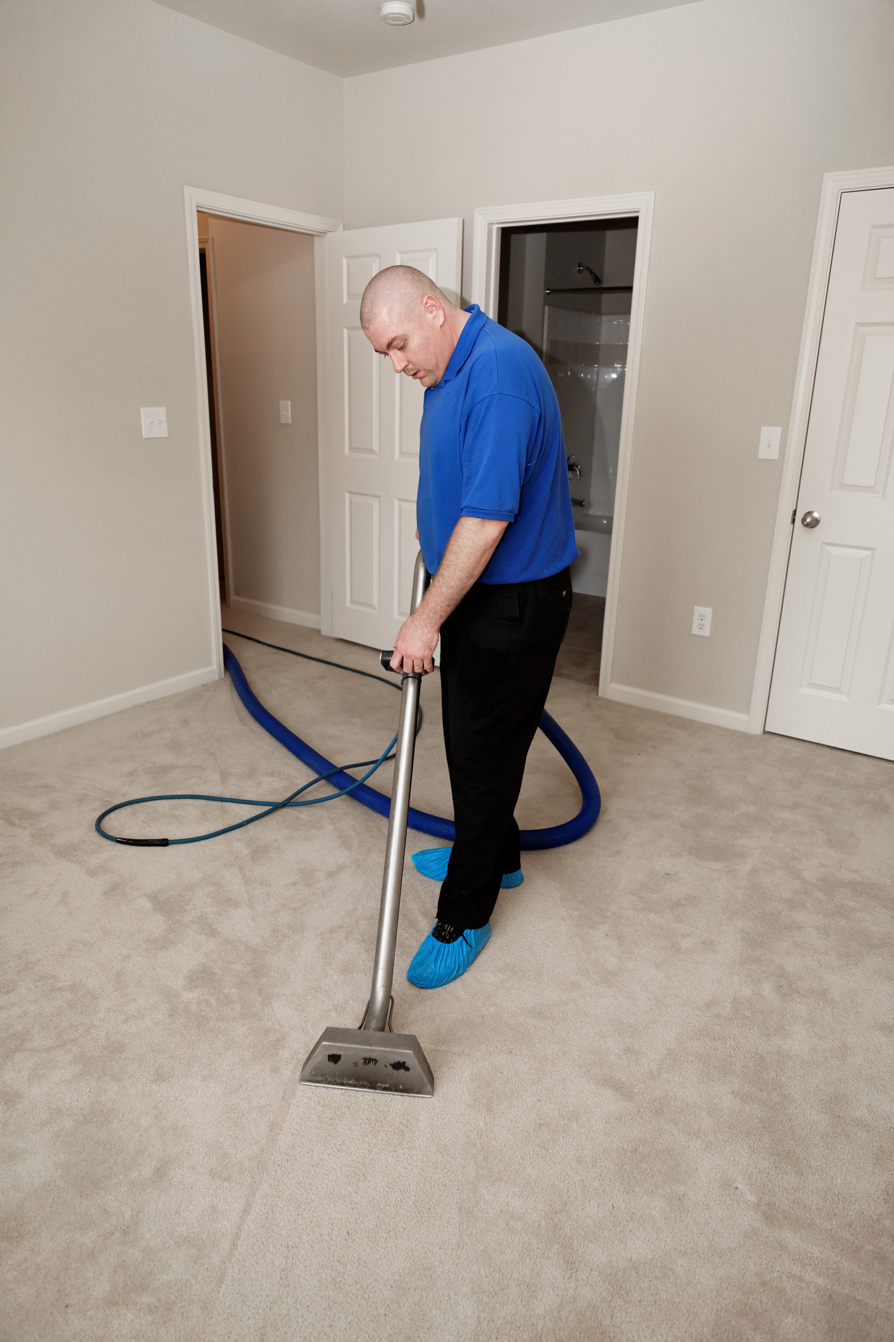 lady cleaning and sanitizing a couch