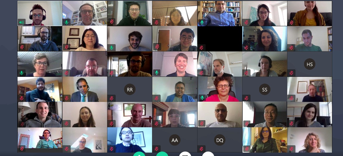 Several individuals on a video call, each displayed in separate windows, interacting and sharing ideas remotely.