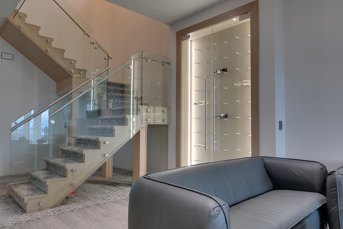 Staircase detail with glass panels and wood treads