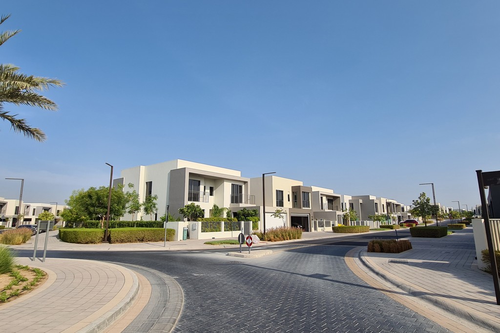 Stylish Sidra Villa in Dubai with modern architecture, large windows, and beautifully manicured gardens.