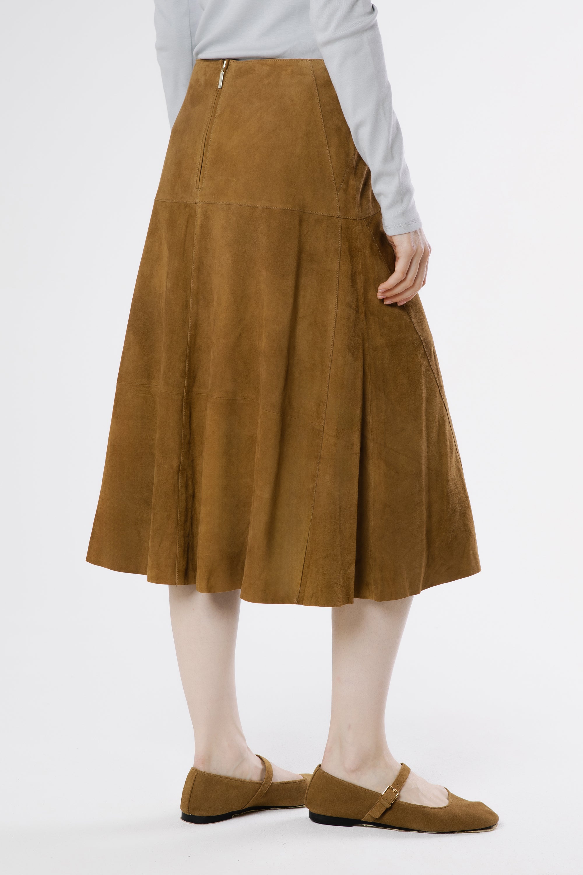 Back view of Milano suede midi skirt in warm oak showing clean lines and fluid drape