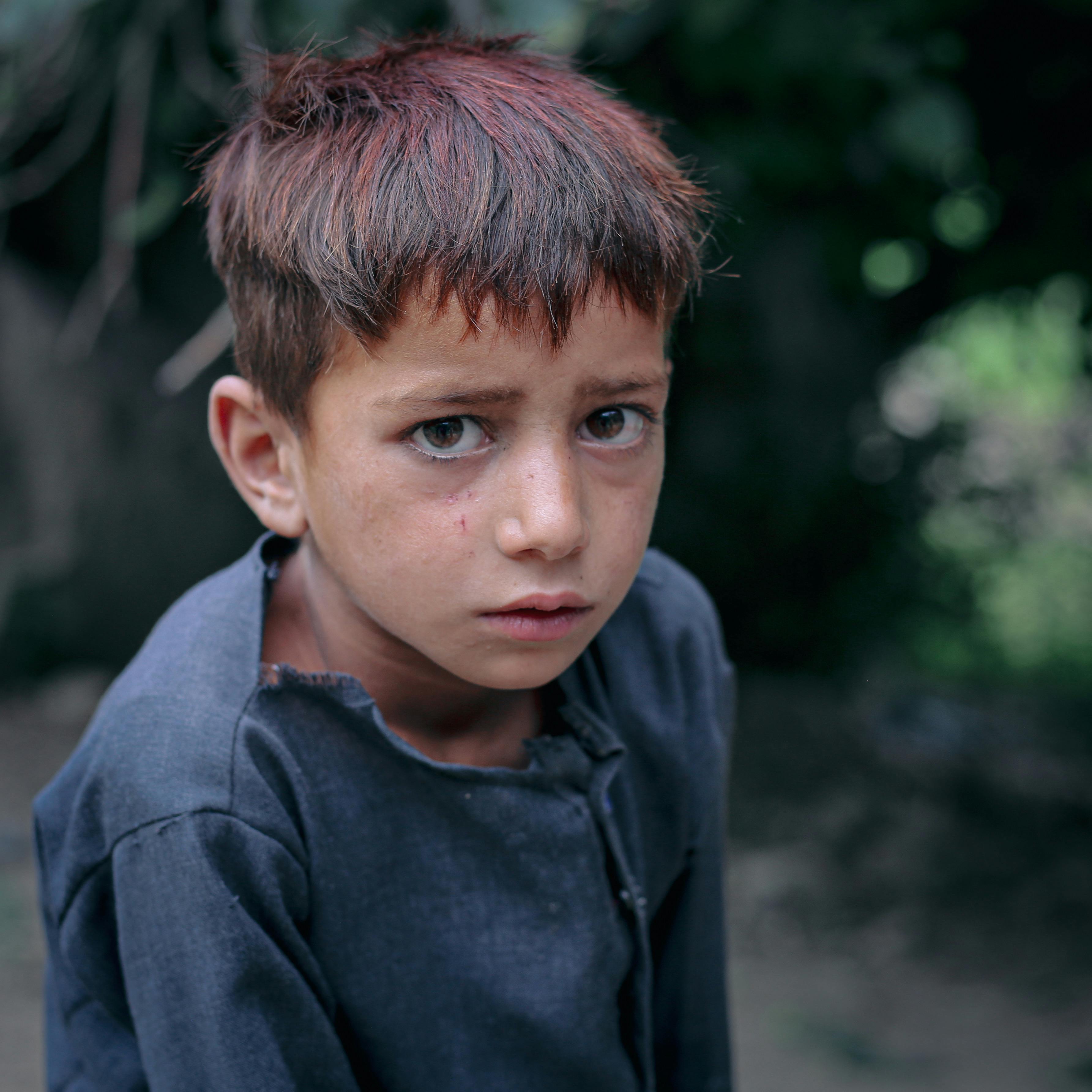 three children at the beach during golden hour
