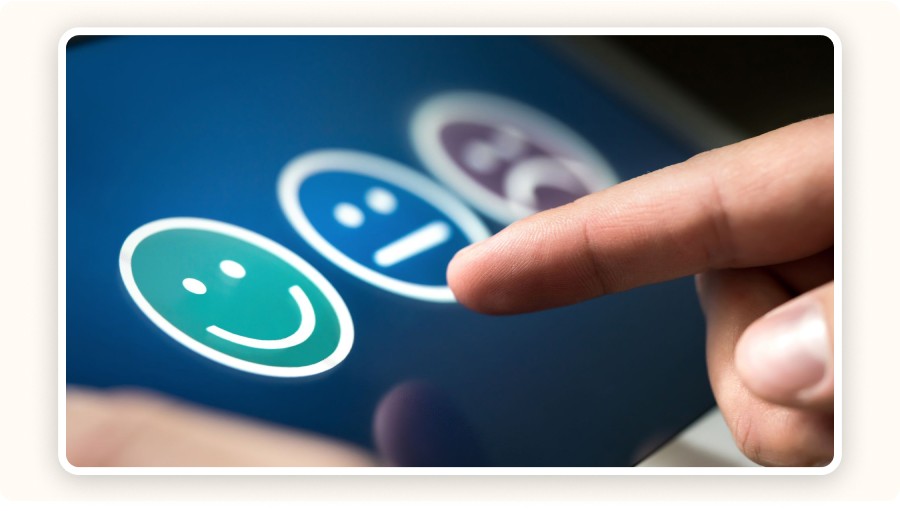 Finger tapping a smiling face icon