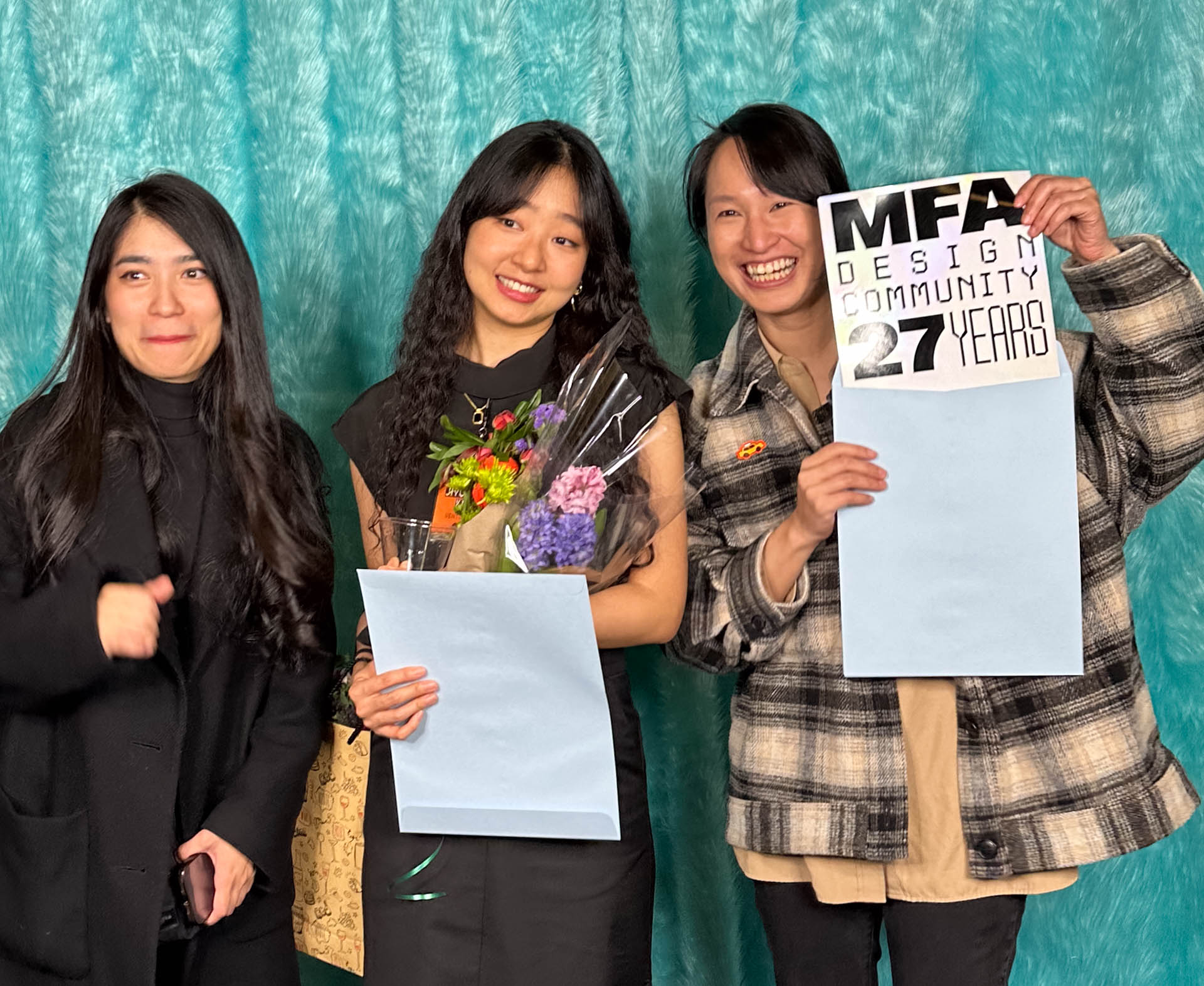 a group of students smiling for the camera in the SVA Theatre lobby after the Venture Forum