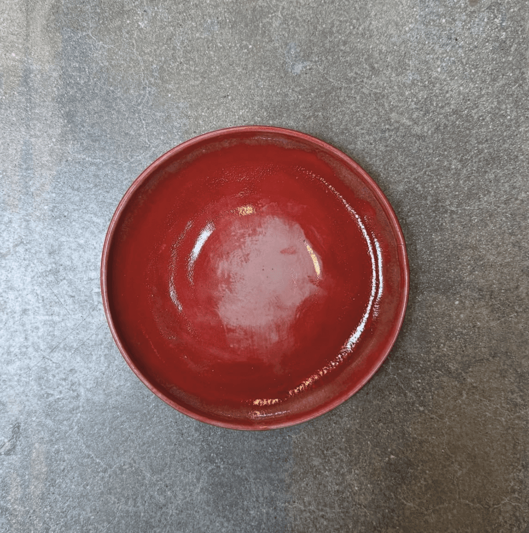 A woman with long hair is looking at the camera