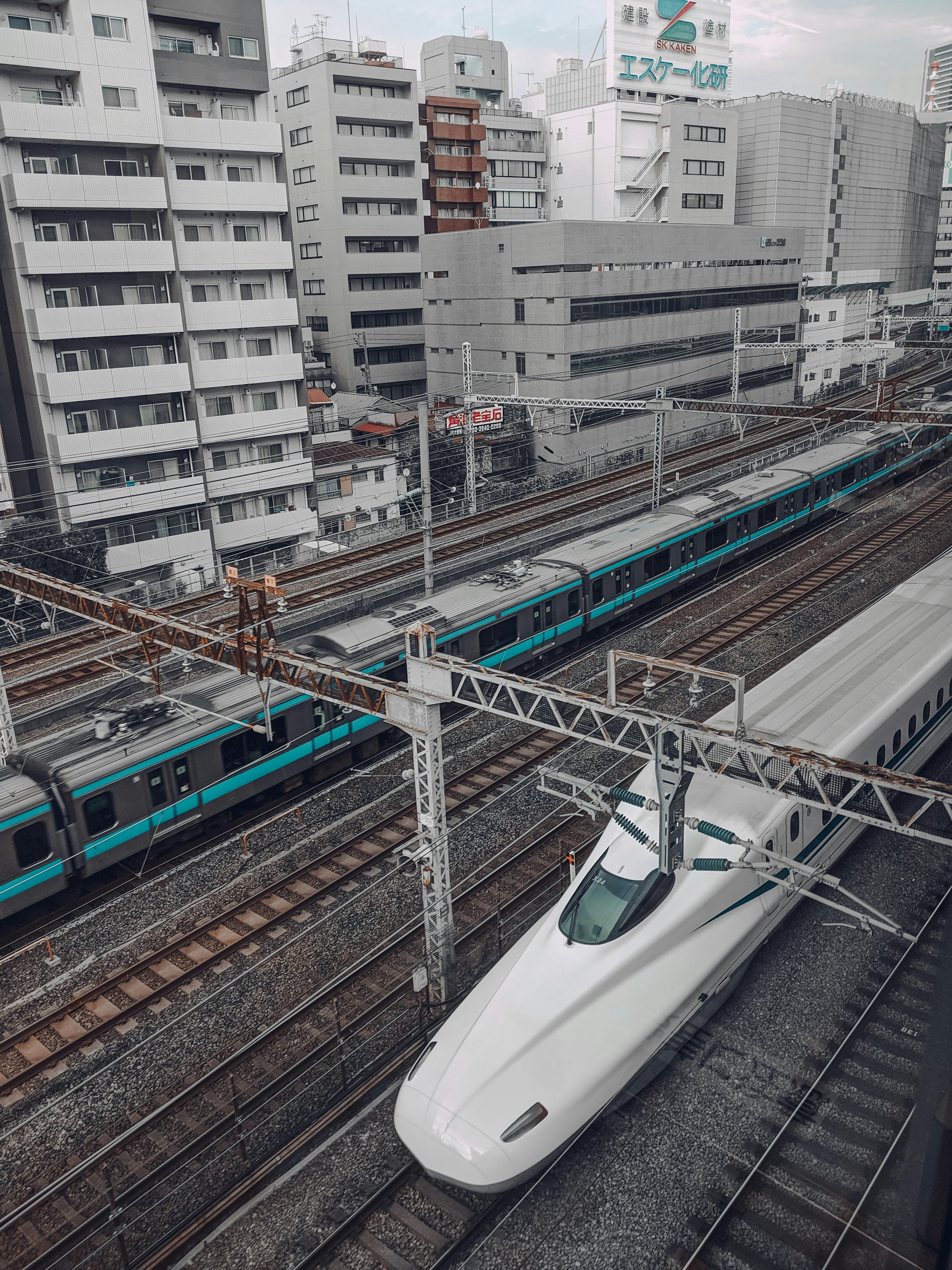 snow covered mountain near lake during daytime