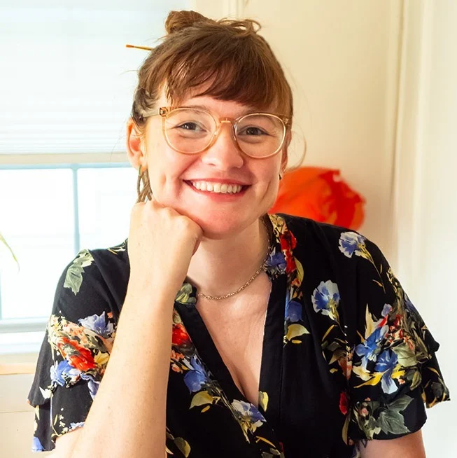 Side shot of a aman wearing a cap with the sun setting in the background