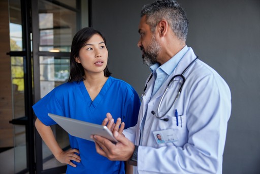 doctor talking to a physical therapist