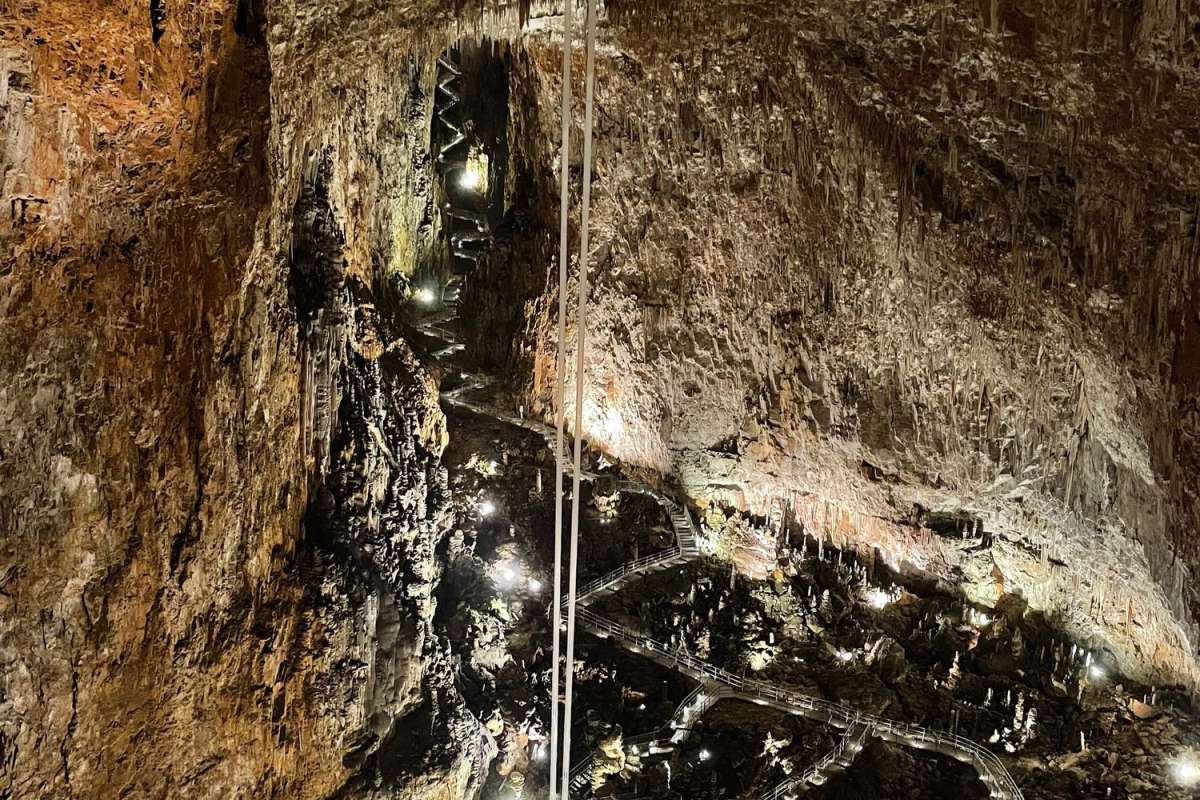 three brown wooden boat on blue lake water taken at daytime