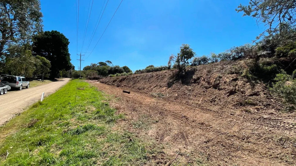 Mowing and clearing overgrowth on challenging slopes