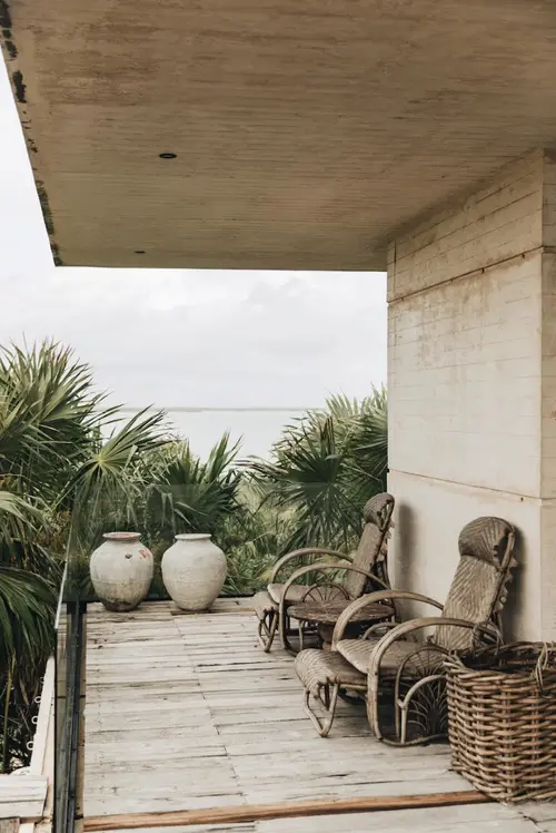 Casa Sastran Villa terrace at Be Tulum with ocean view, nature, palm trees, and seating