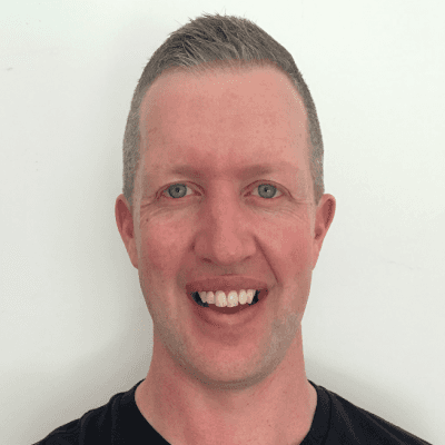 man in green crew neck shirt and black hat