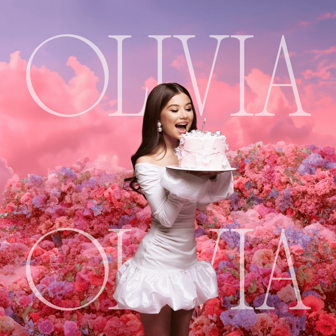 Anime-style illustration of a young woman working at a creative studio desk