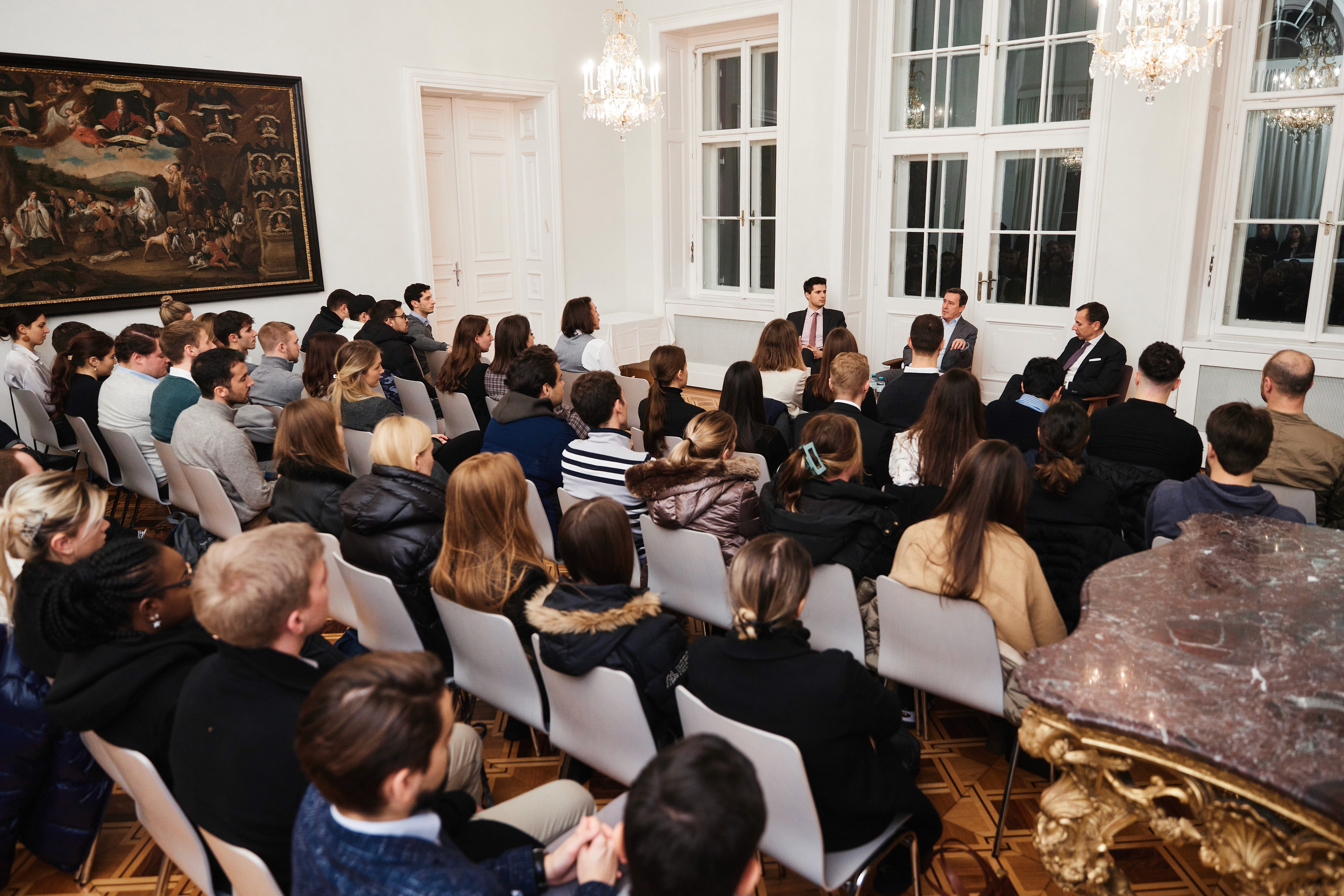 Mag. Roland Schöbel, Partner and Member of the Territorial Leadership Team at PwC Austria talking to LBS students