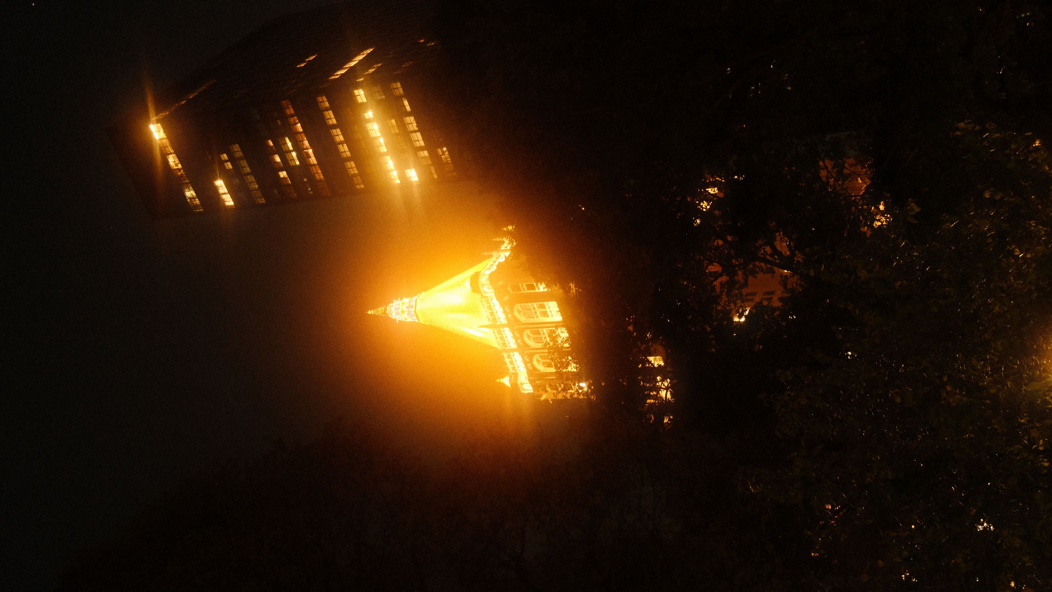 a group of people walking on a sidewalk