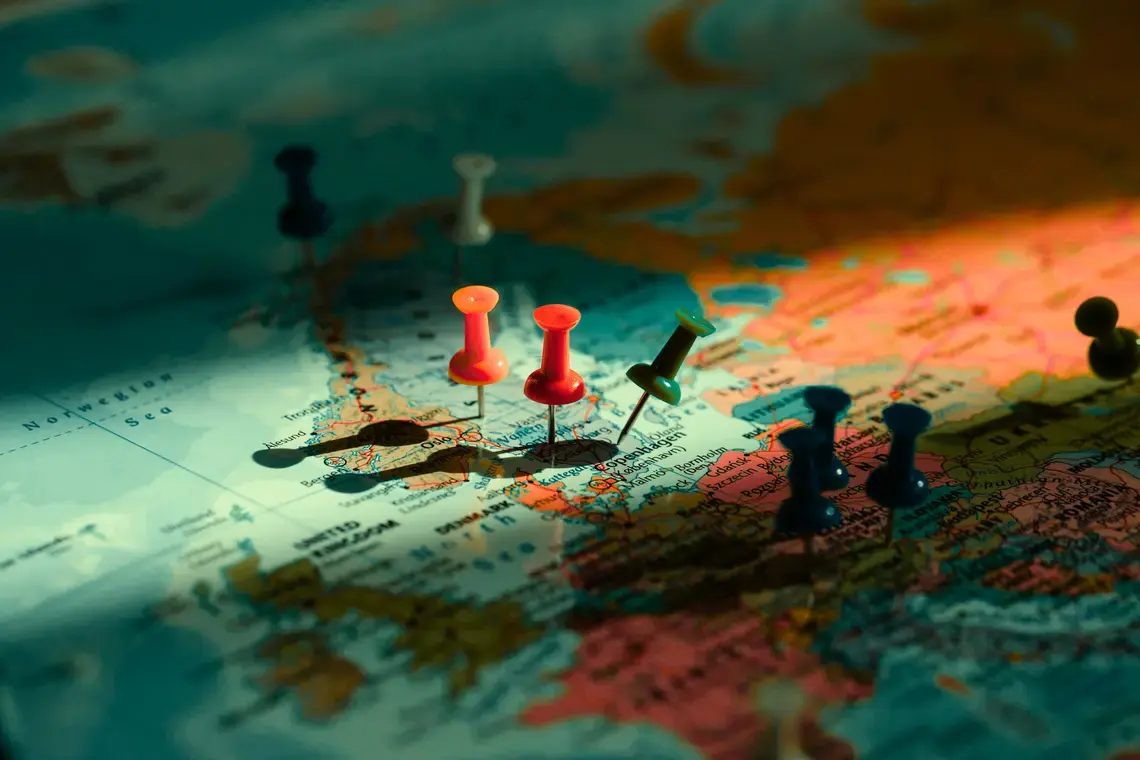 Pushpins on a world map