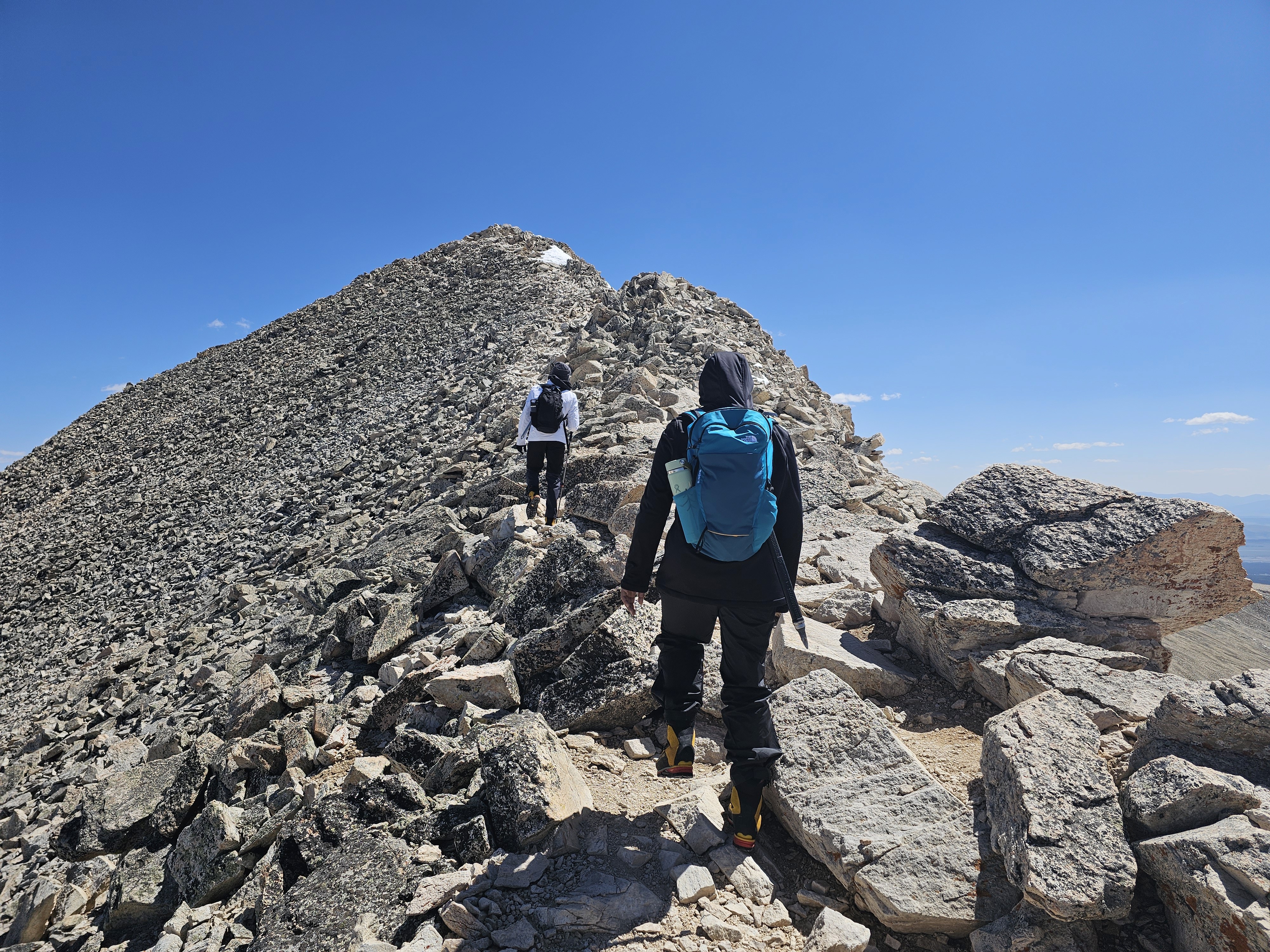 Hikers ascend the final ridge to the summit of Mt. Sherman