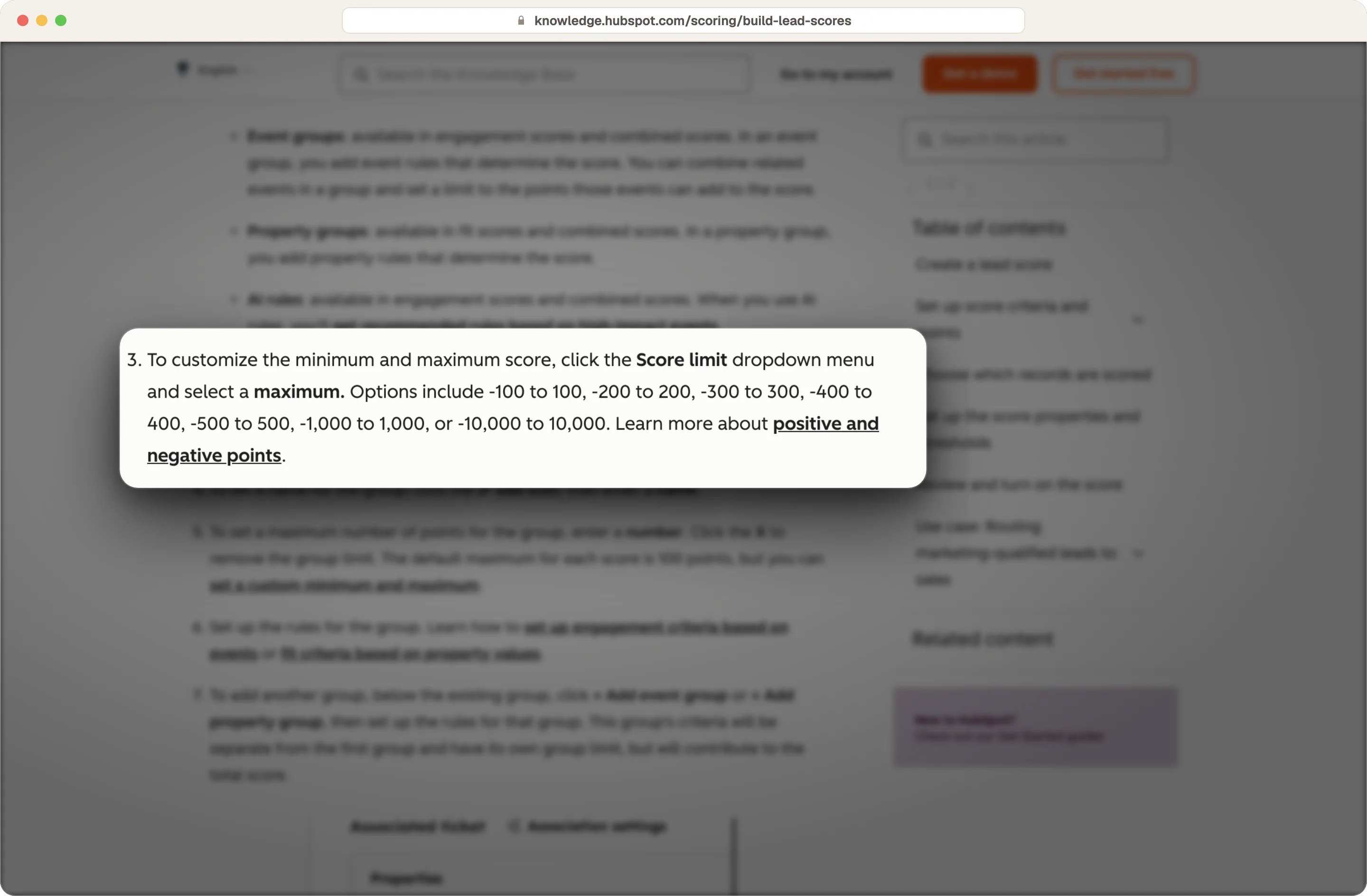 HubSpot knowledge base showing score limit options from -100 to 100 up to -10,000 to 10,000