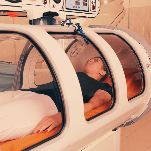 a woman experience a HBOT treatment