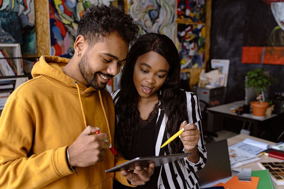 B2B buyers collaborating on a tablet to place a wholesale order