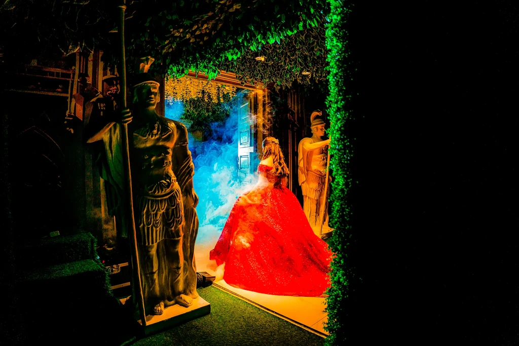 Debutante in red at the statue doorway of Pandora Hall, Stalla Suites Events Place