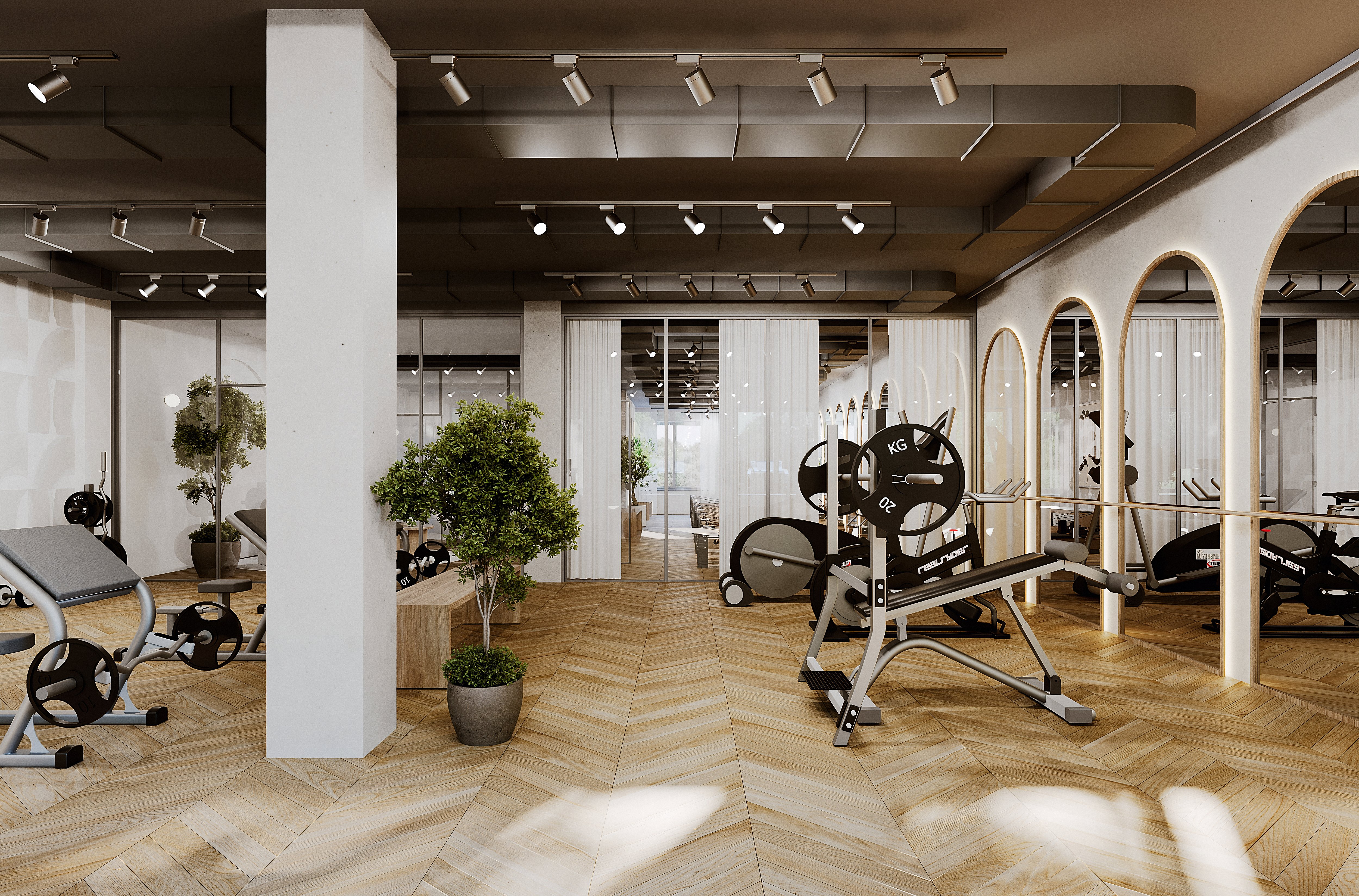 A spacious indoor café with wooden floors, large windows, plants, and a mix of seating areas and workspace.