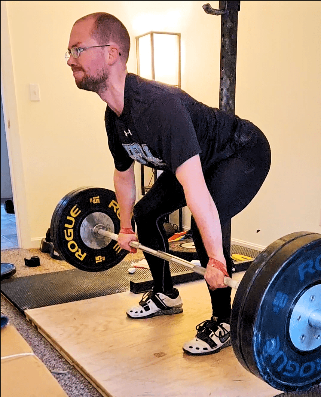man performing a deadlift
