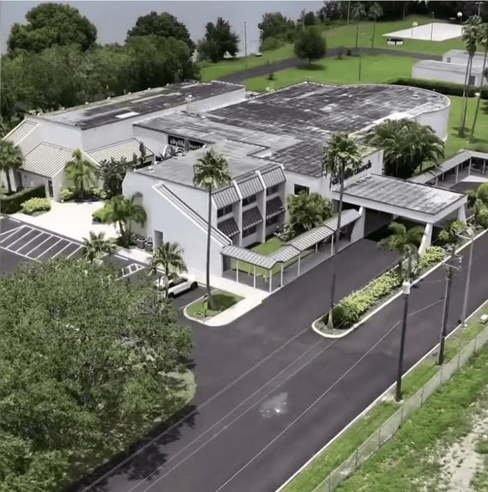 a building with trees and plants
