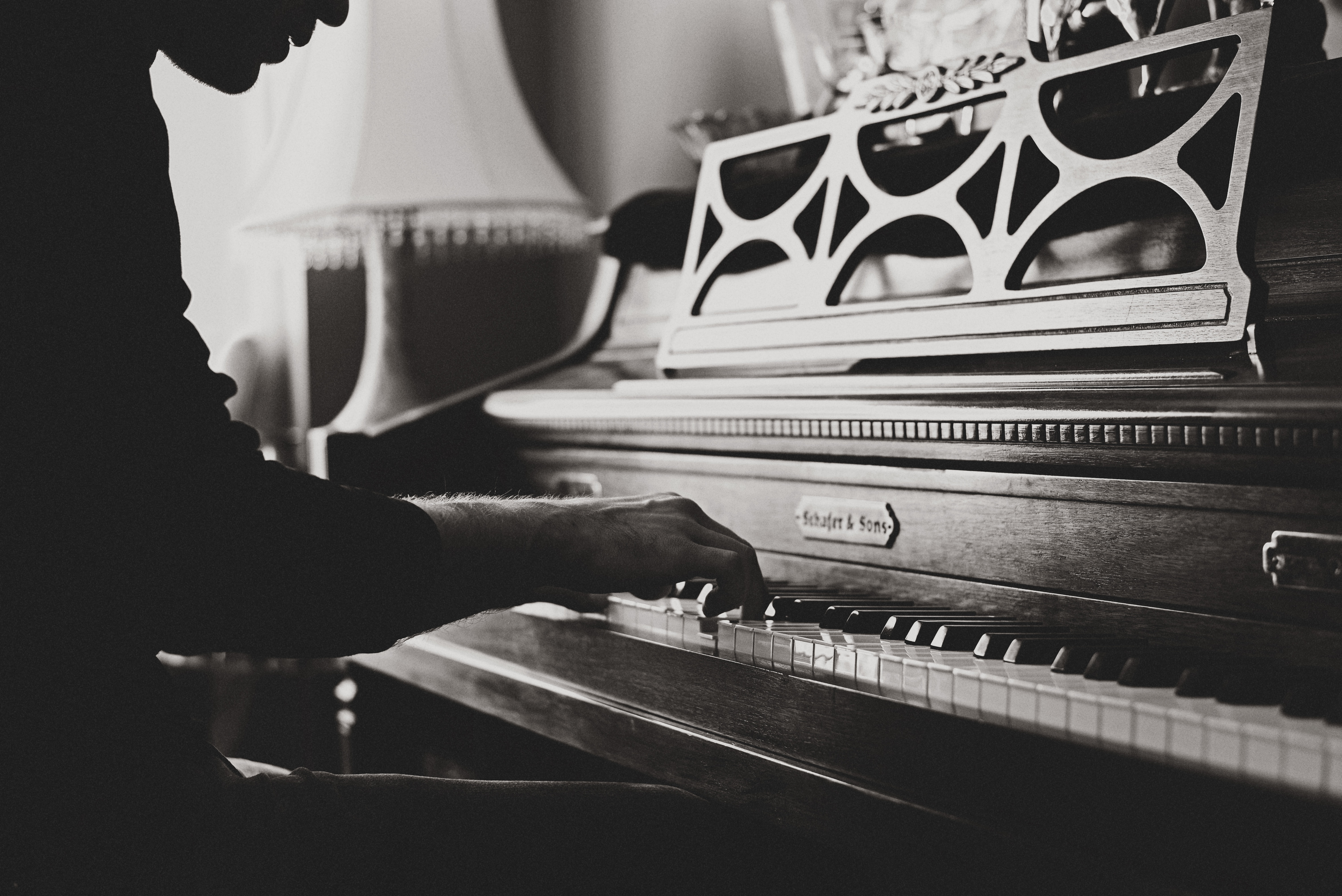 man playing a piano - how to write love songs