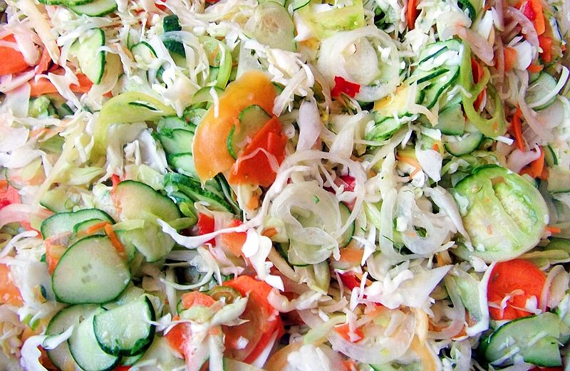 two people looking at a tablet and smiling