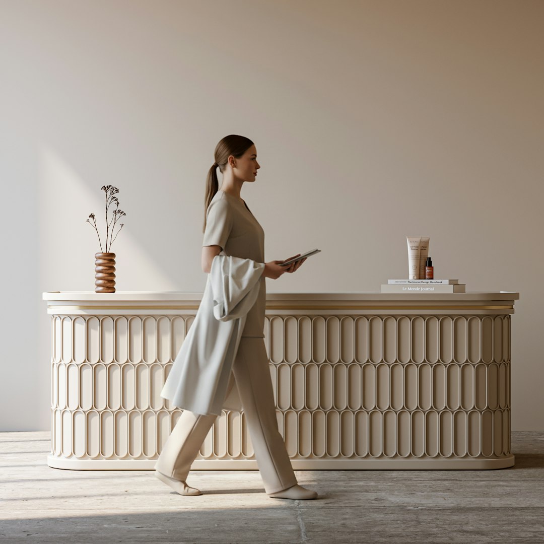 Woman walking past a decorative reception desk