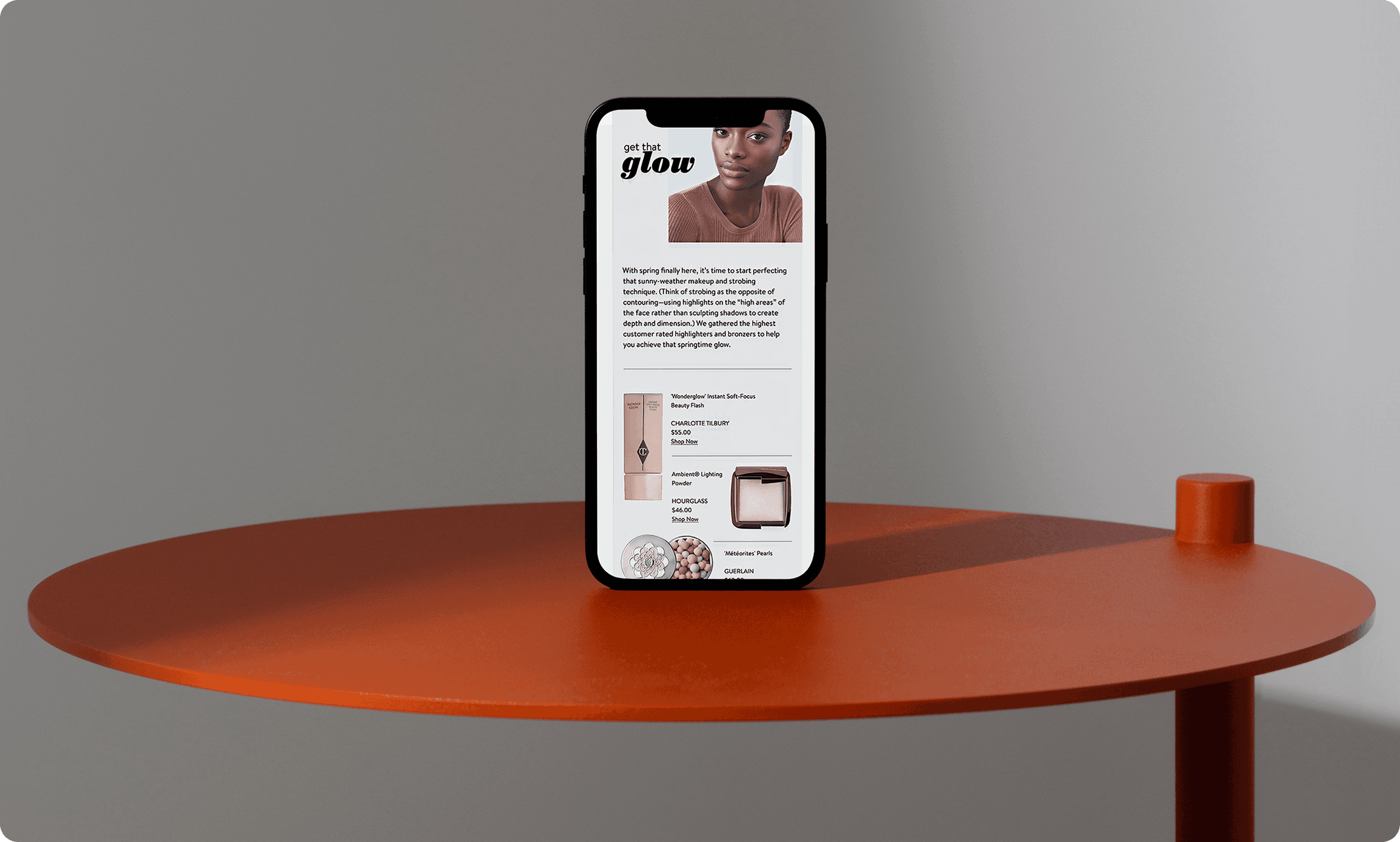 Nordstrom beauty mobile app displaying 'get that glow' skincare products on smartphone placed on modern orange table