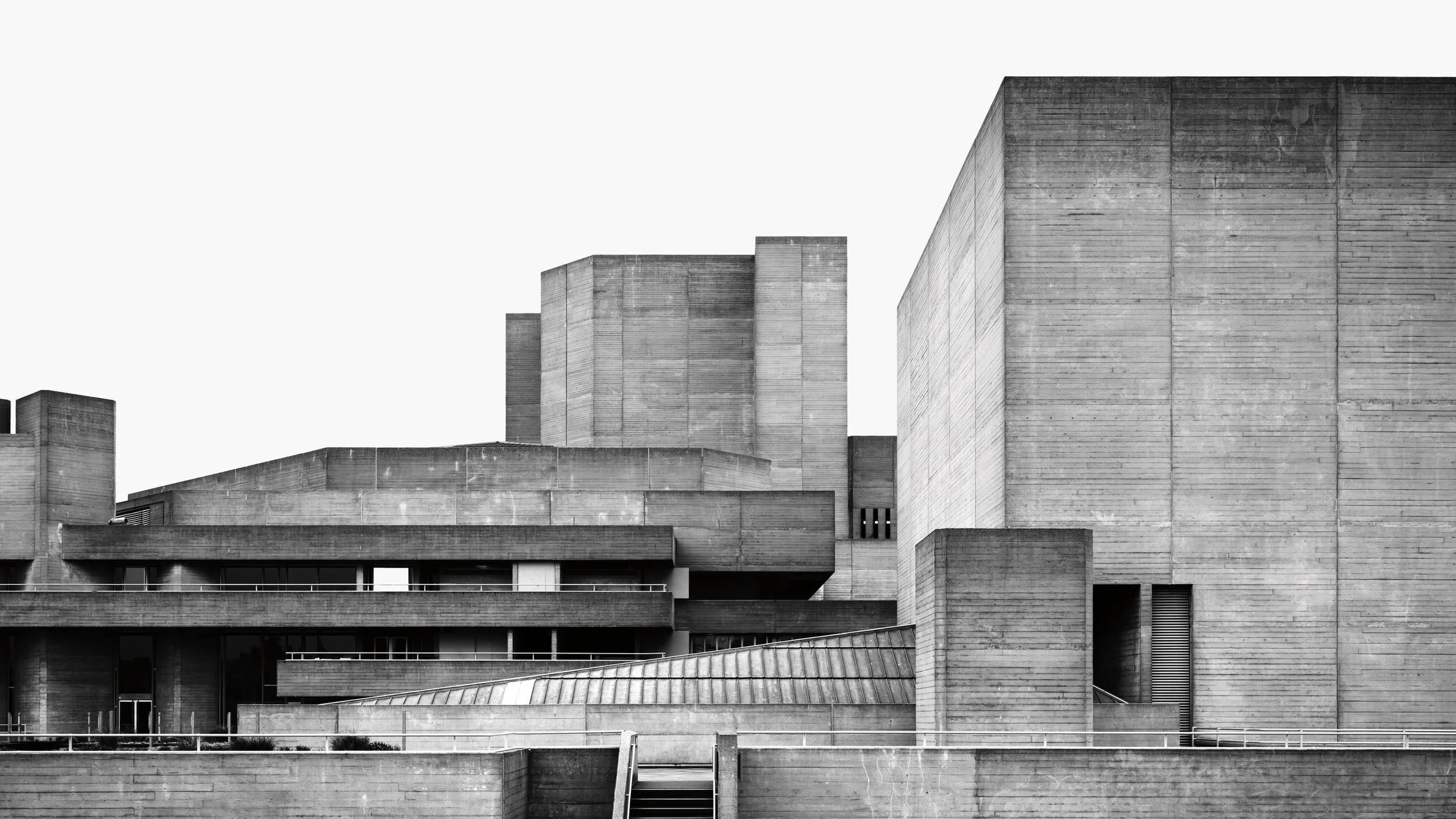Black and white image of modernist architecture featuring geometric shapes and prominent concrete structures.