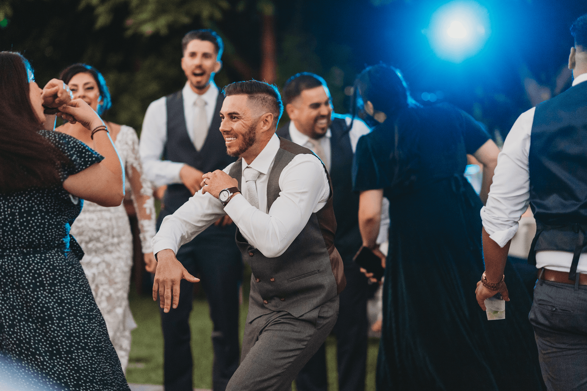 Flat lay wedding details with bouquet, rings, and sparkling bridal heels