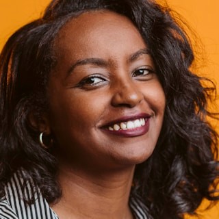 Business professional profile portrait: a woman with a smile on her face