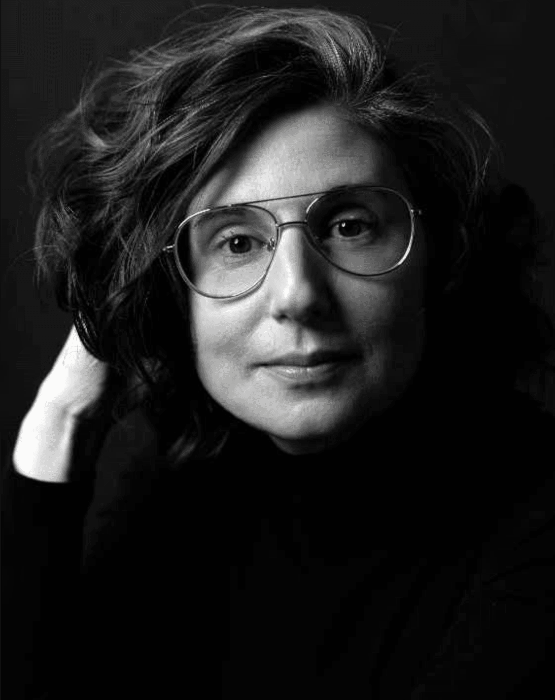 Black and white portrait of a woman (Julia Ames) with glasses