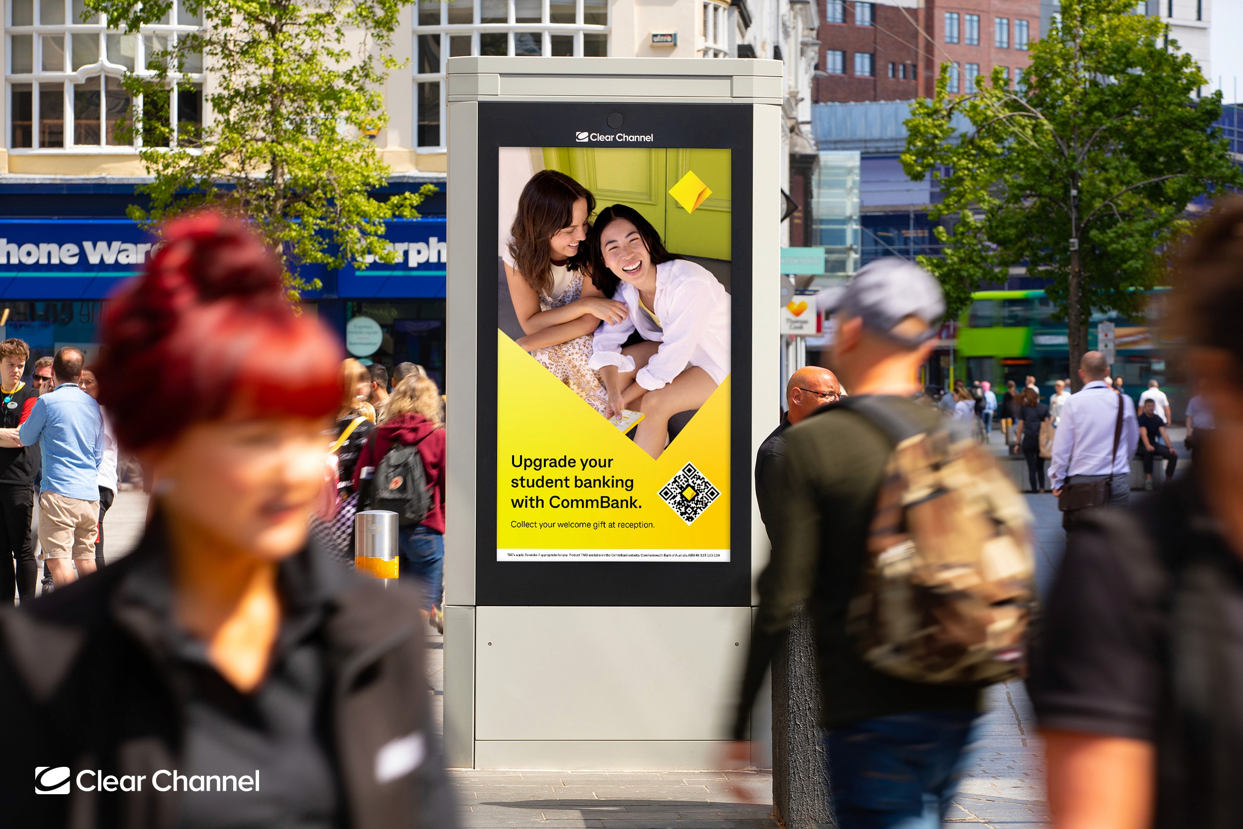 Bright orange drawstring fabric bag tied at the top, printed with a bold black smiley face and the text “Smiley Co” above it against an orange background.