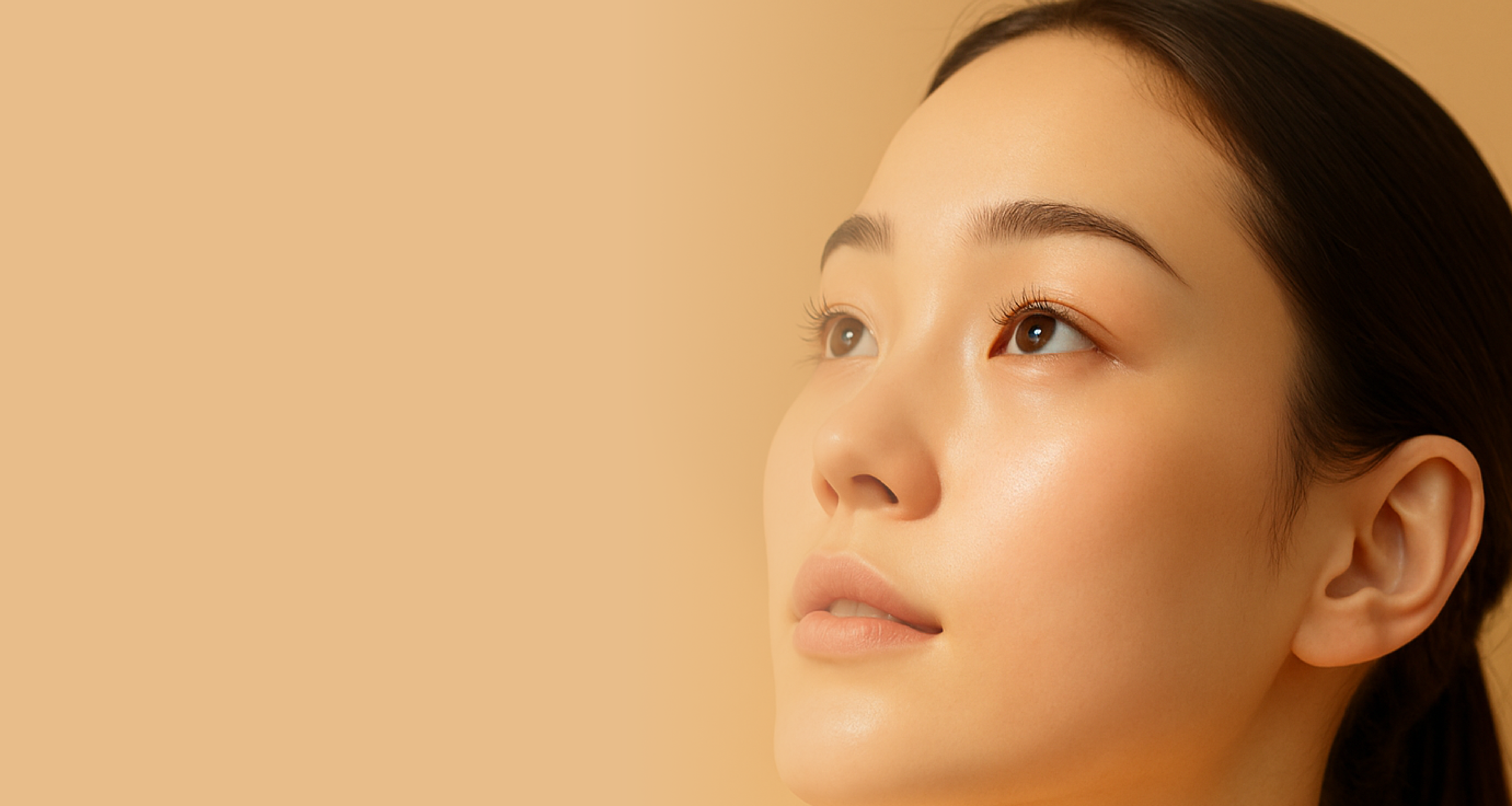 Image of beautiful woman looking up