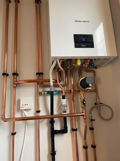 Close-up of home heating unit and copper piping system