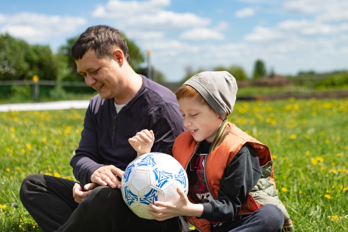 Group of girls seated around a table, actively engaging in a debate about an activity