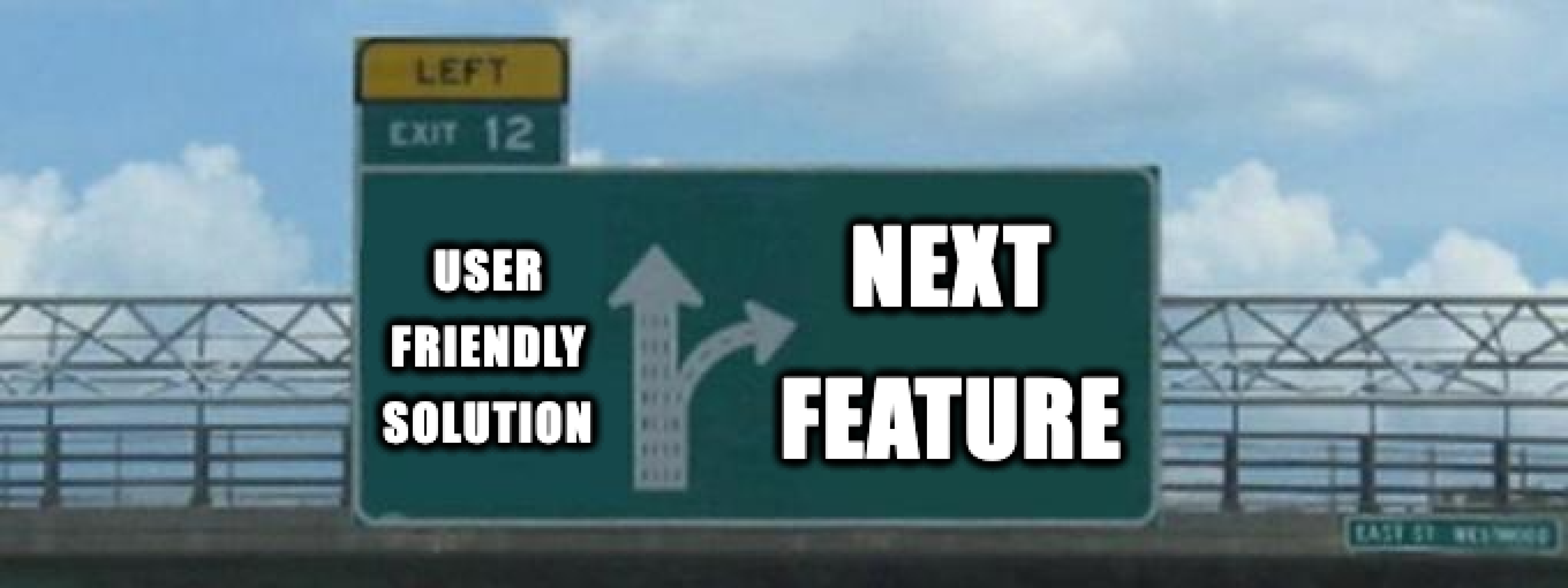 The meme image of a a motorway sign with the straight arrow saying "user friendly solution" and the right arrow saying "next feature". The car is cropped out of the image.