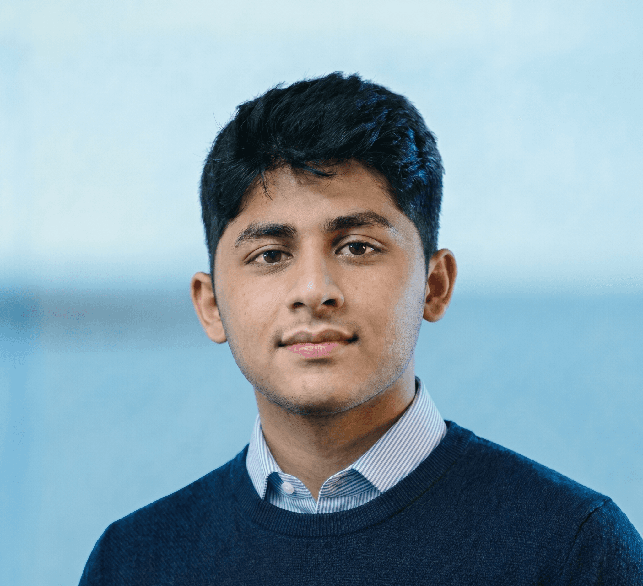 Black and white portrait of a man with a beard and glasses