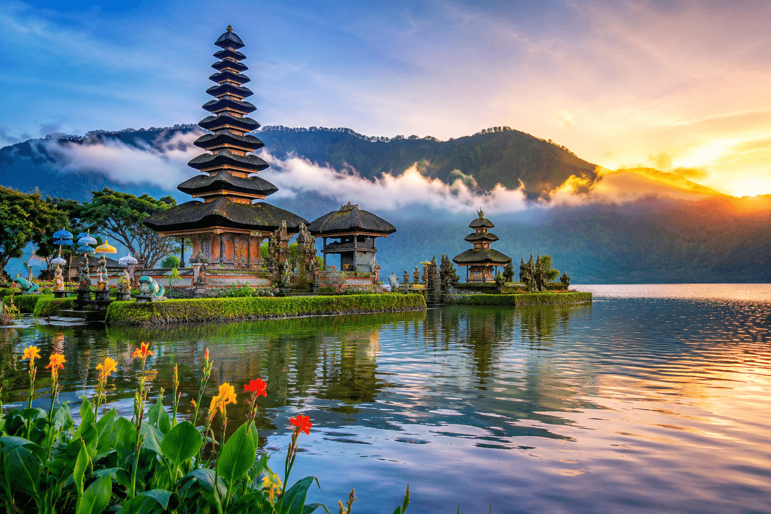 Balinese temple by misty lake at sunrise
