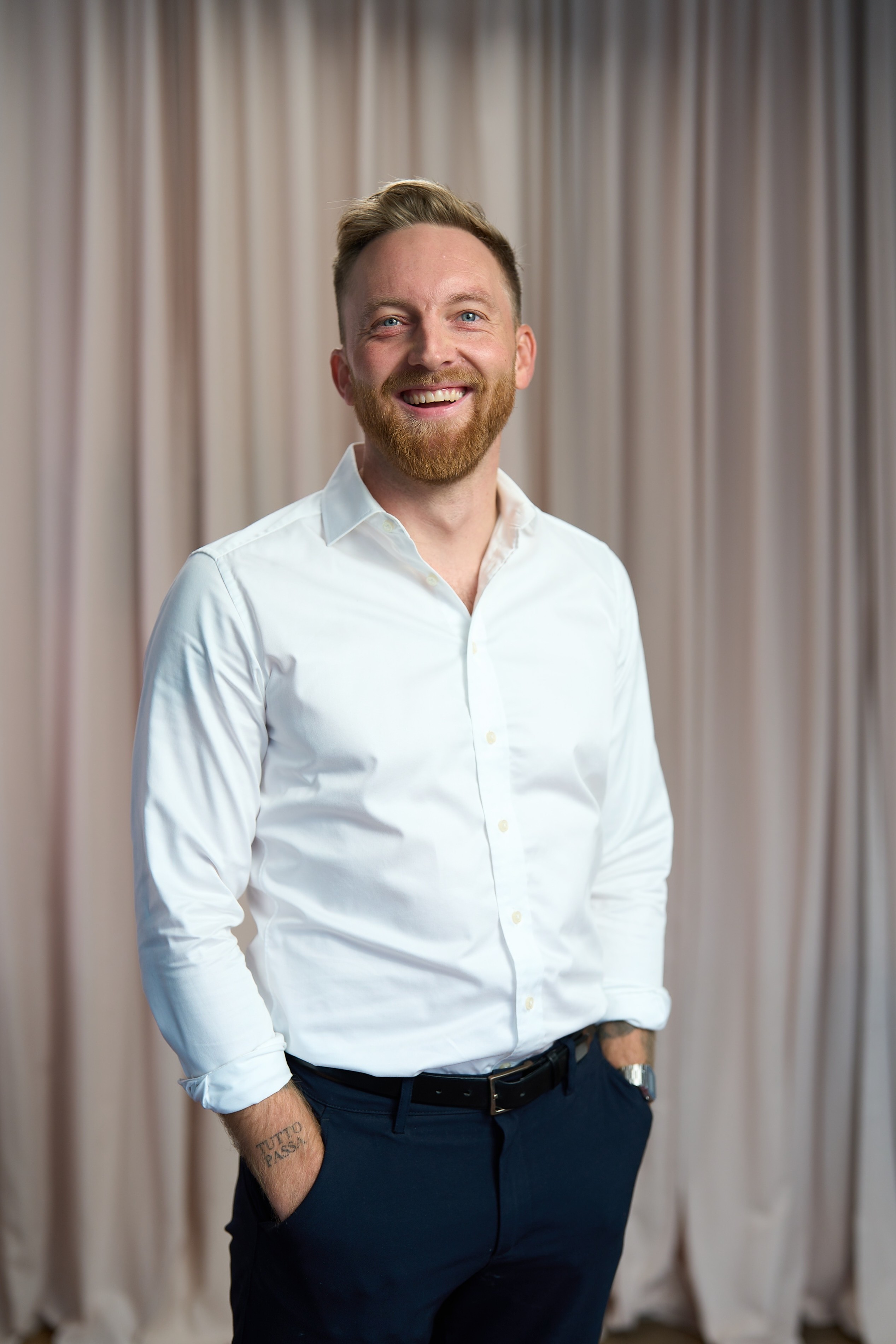 man standing beside wall