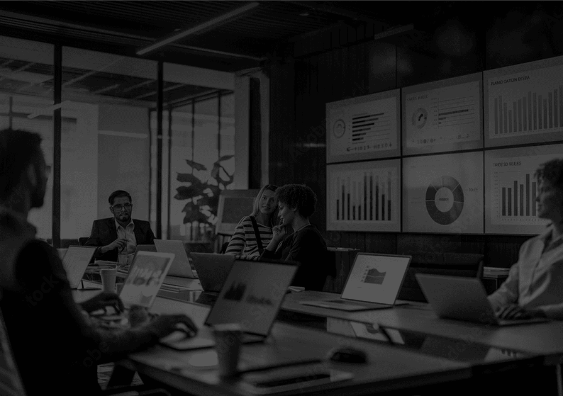 Team working in an office watching at a presentation