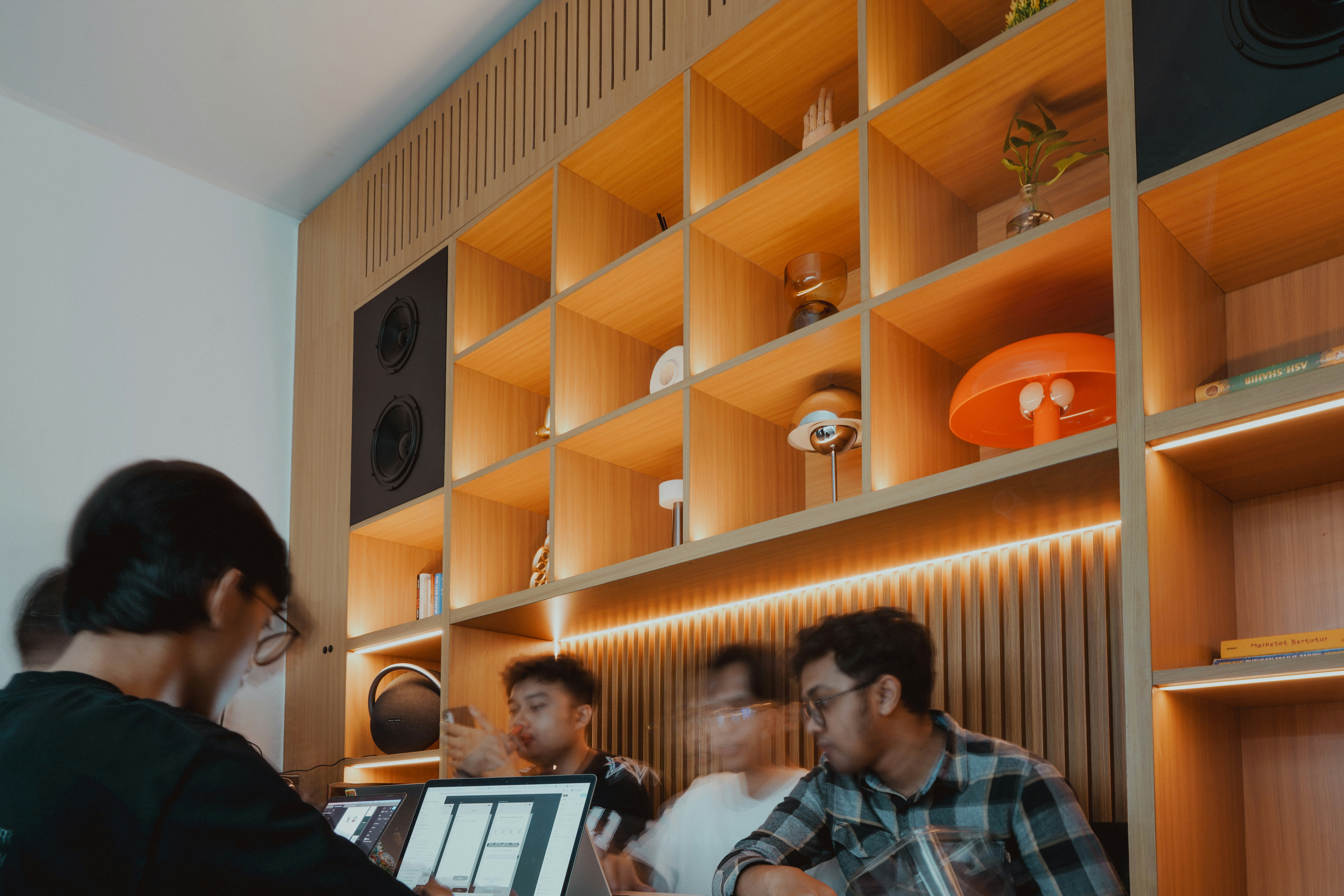 People sit and work in a cafe.