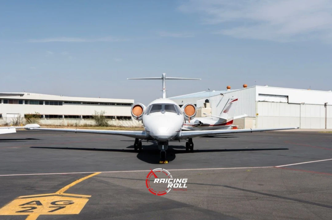 Three people sitting on a couch in a room looking at mobile devices