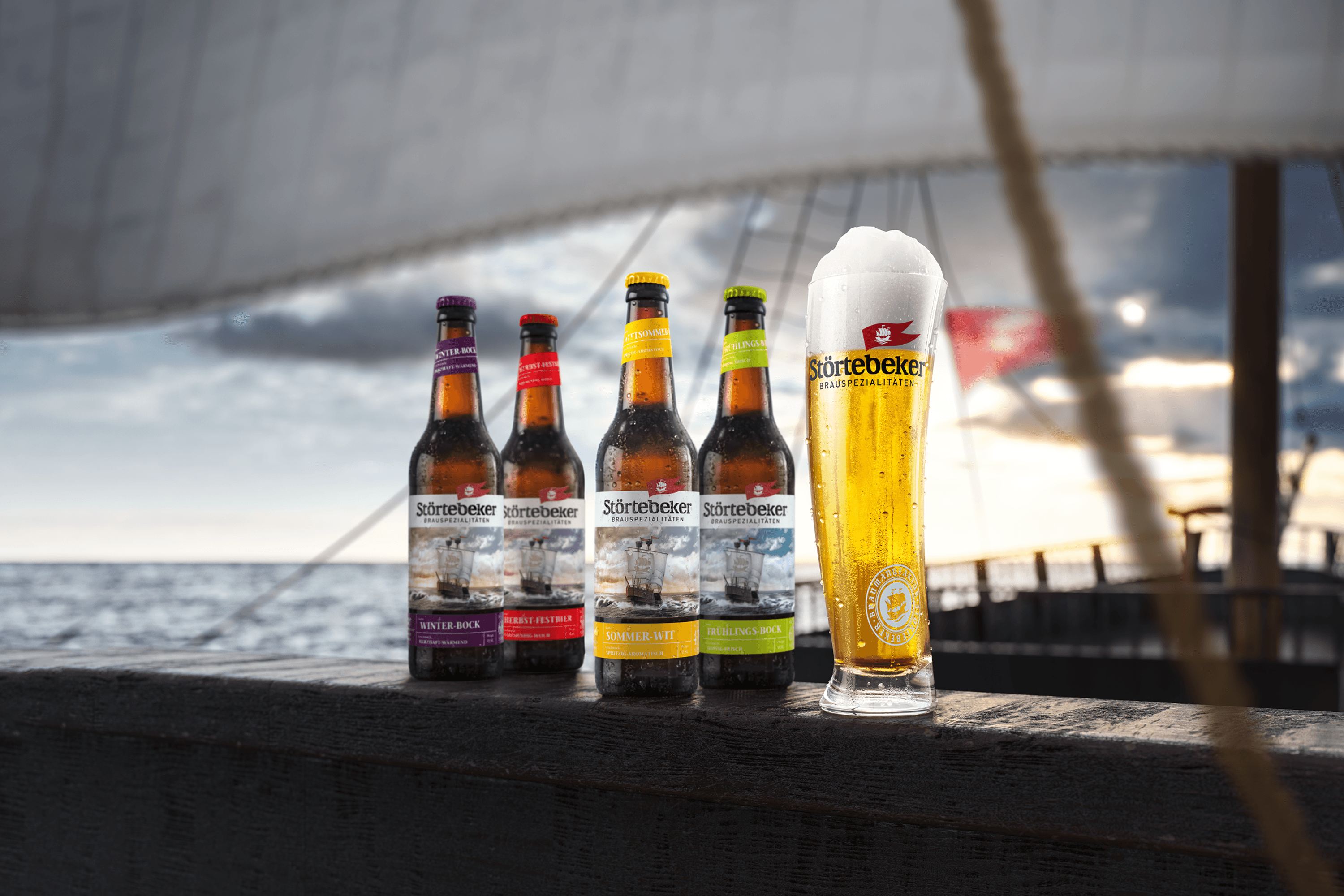 Störtebeker beer bottles and glass by the sea