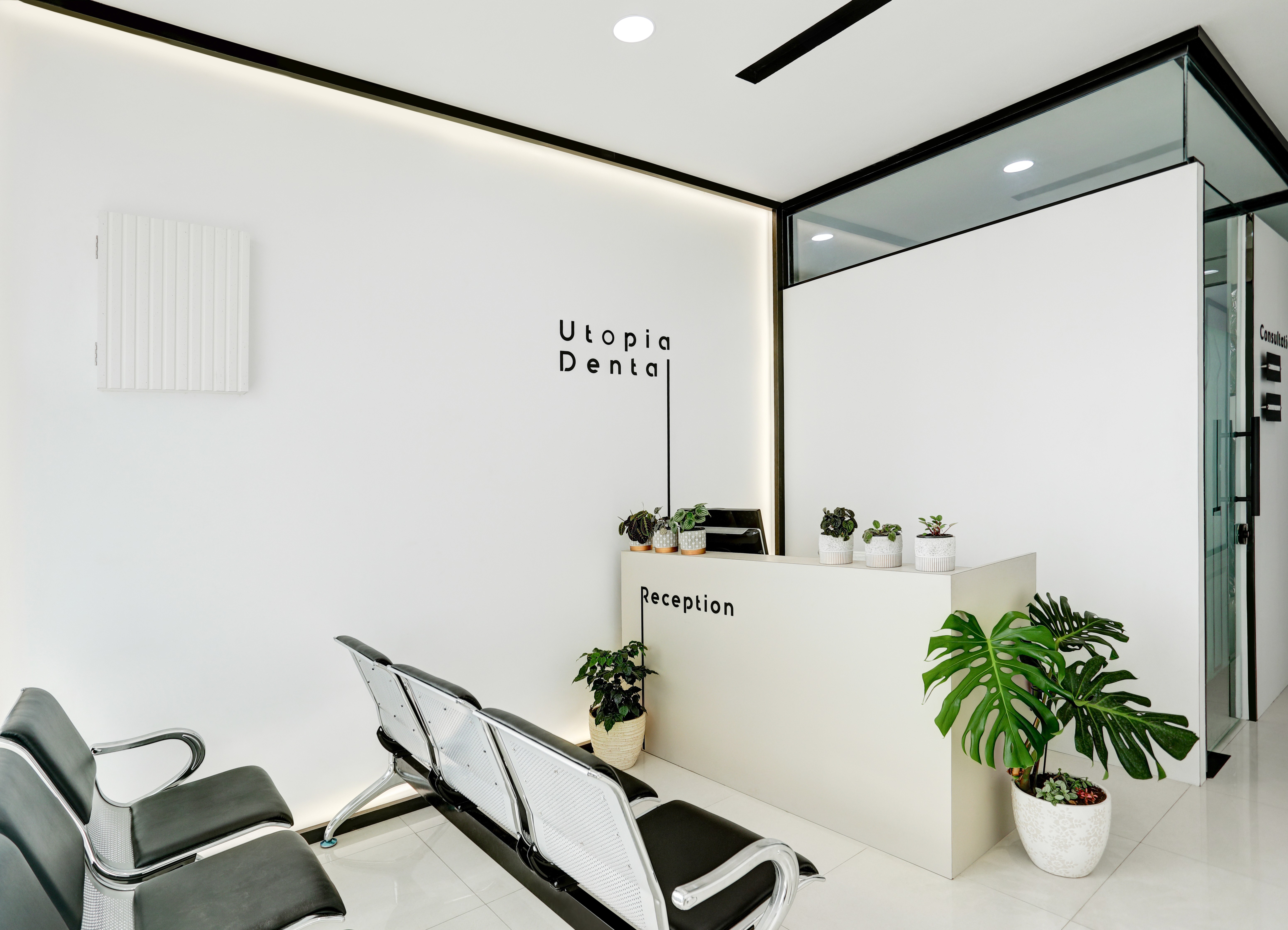 woman in white scrub suit holding white and green hose